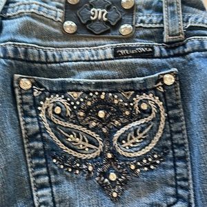 Size 29 waist miss me jeans slight distress with denim fading in front